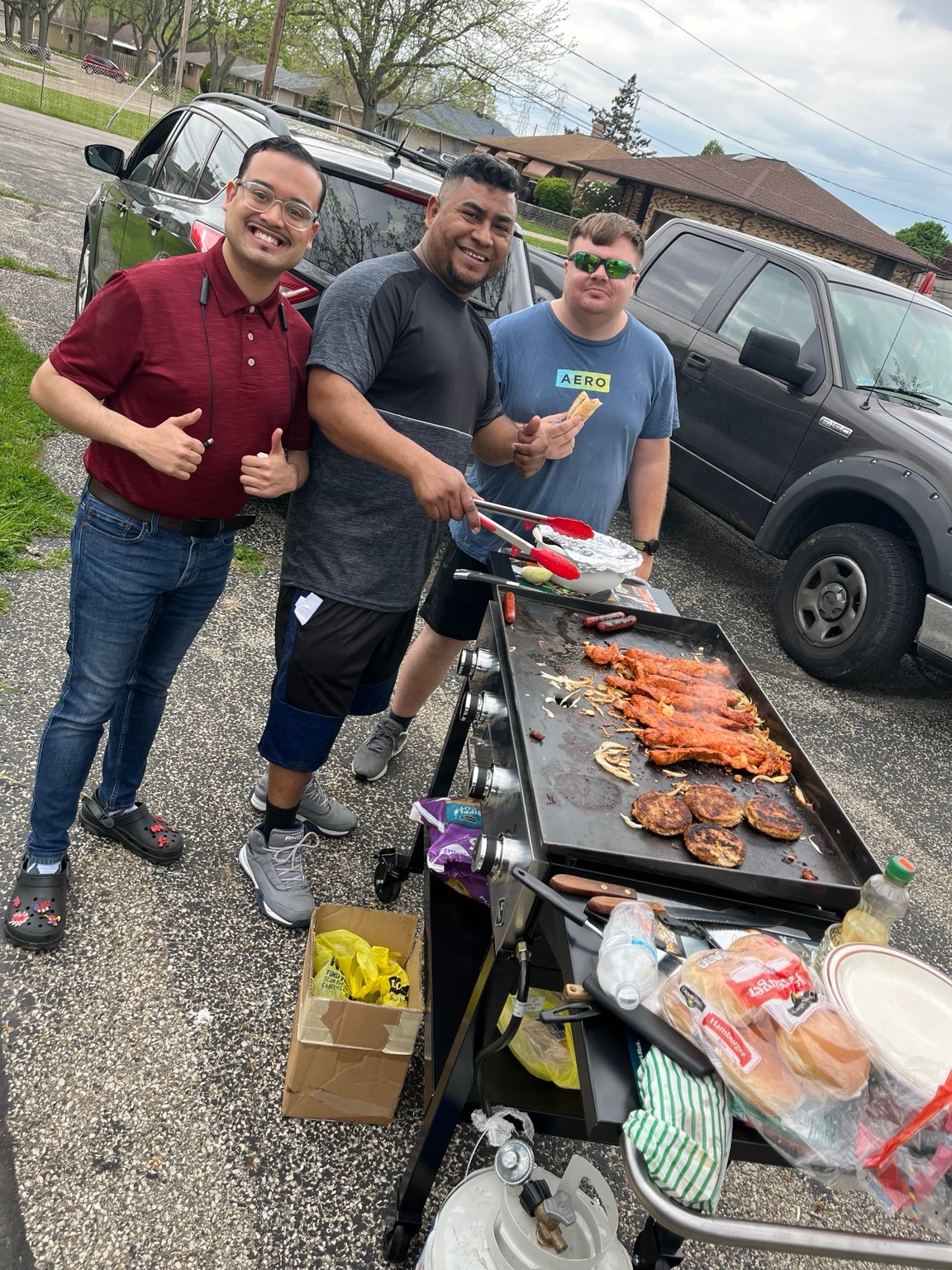 Community members cooking together outdoors