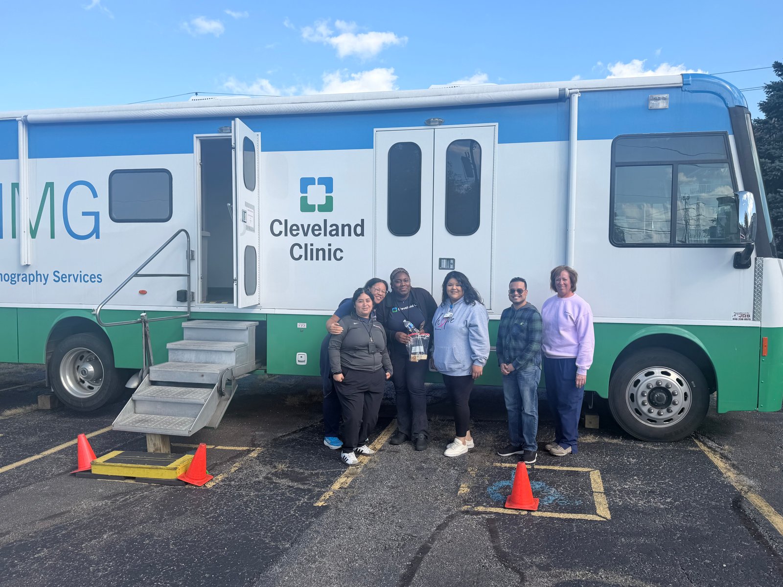 Community members beside the Cleveland Clinic mobile mammography unit