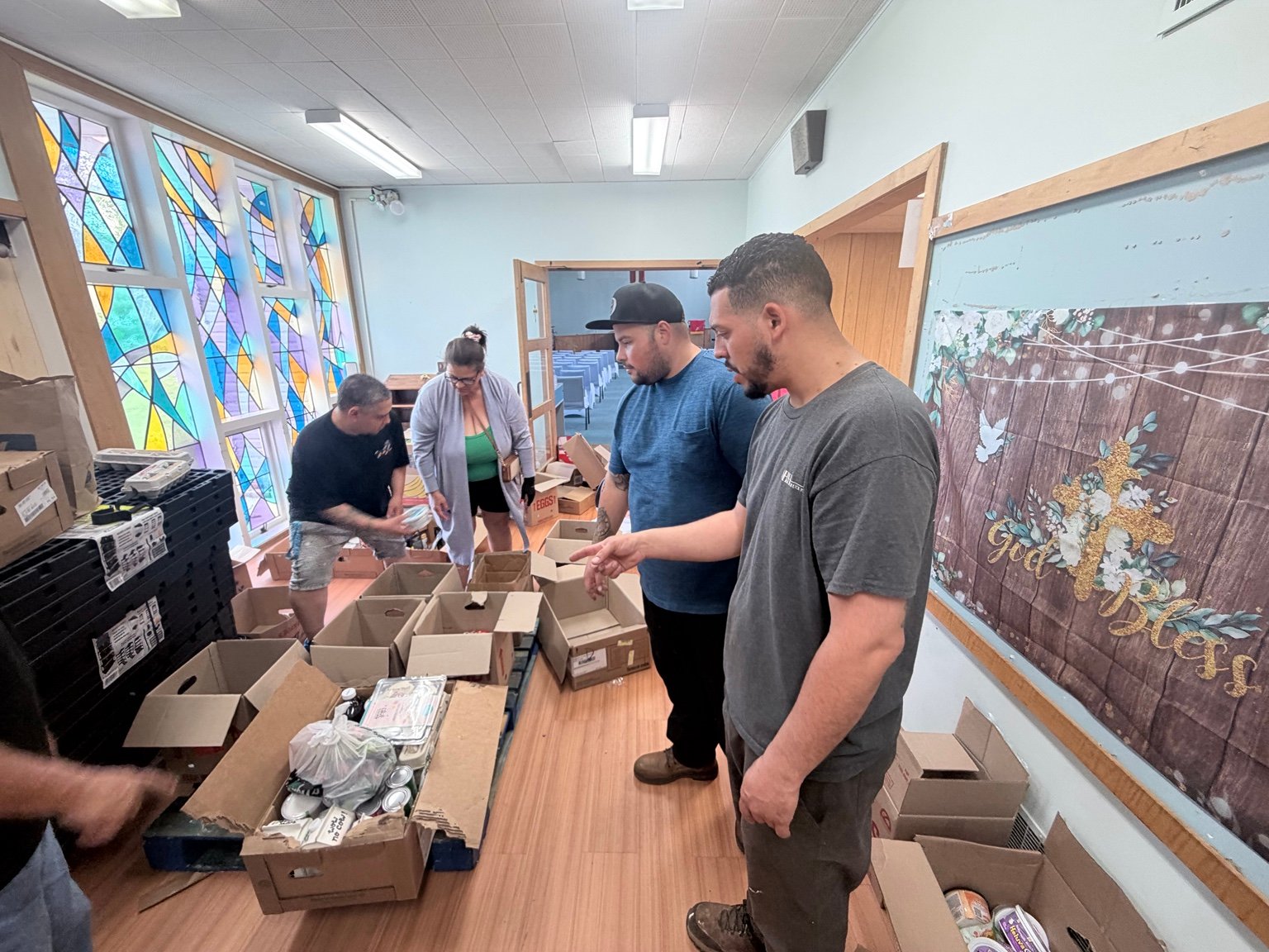 Community volunteers packing food boxes together
